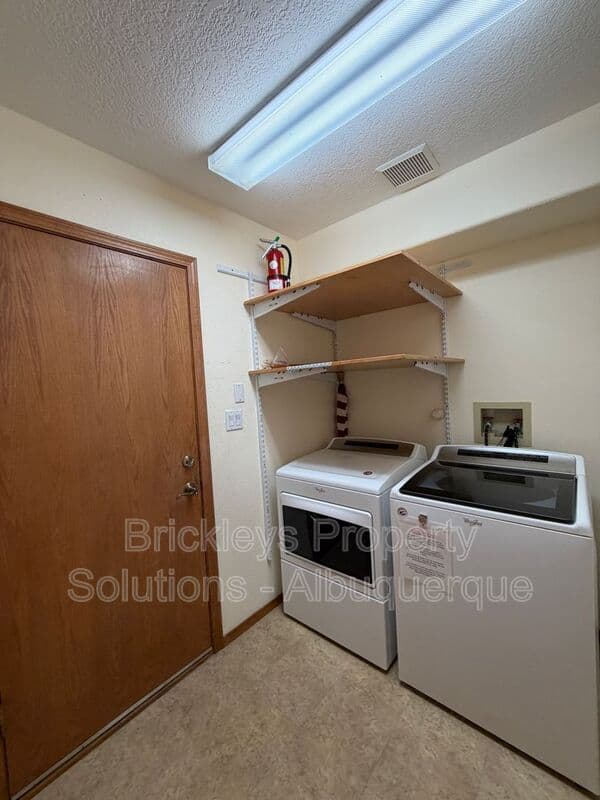 3-bedroom 2.5-bath home at 9600 Allande Rd NE for $3,200/mo managed by Brickleys Property Solutions Albuquerque — photo 34 of 40