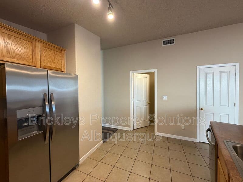 3-bedroom 2-bath home at 1548 Reynosa Loop SE for $1,900/mo managed by Brickleys Property Solutions Albuquerque — photo 7 of 31