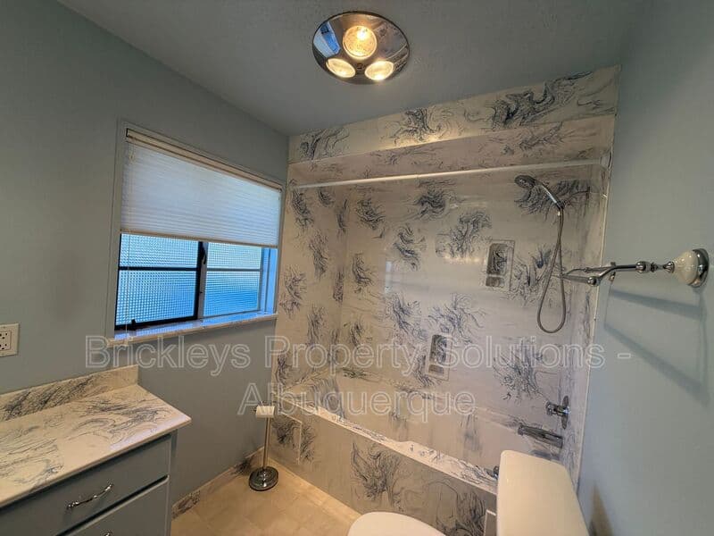 4-bedroom 3-bath home at 7121 Edwina Ave NE for $2,450/mo managed by Brickleys Property Solutions Albuquerque — photo 30 of 47