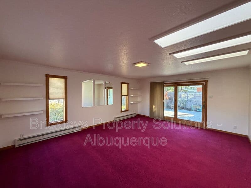 4-bedroom 3-bath home at 7121 Edwina Ave NE for $2,450/mo managed by Brickleys Property Solutions Albuquerque — photo 16 of 47