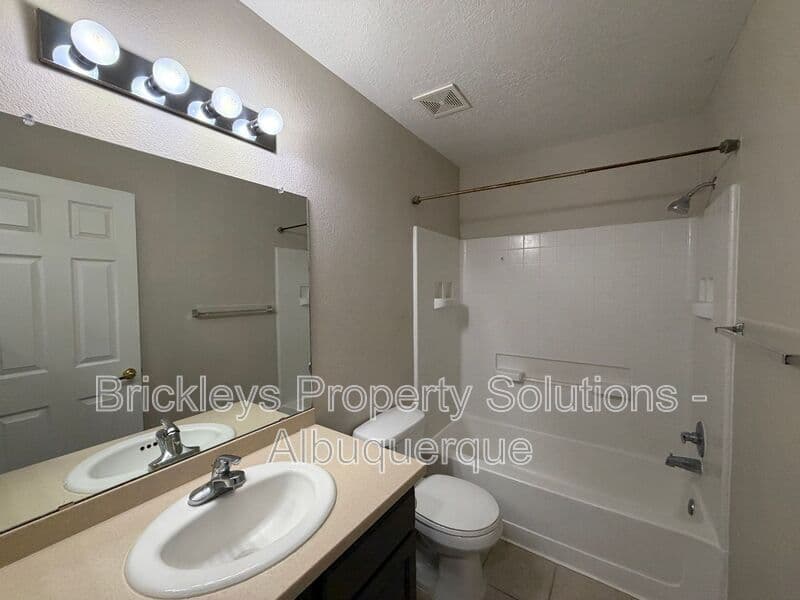 5-bedroom 4.5-bath home at 7008 Tree Line Ave NW for $2,500/mo managed by Brickleys Property Solutions Albuquerque — photo 17 of 43