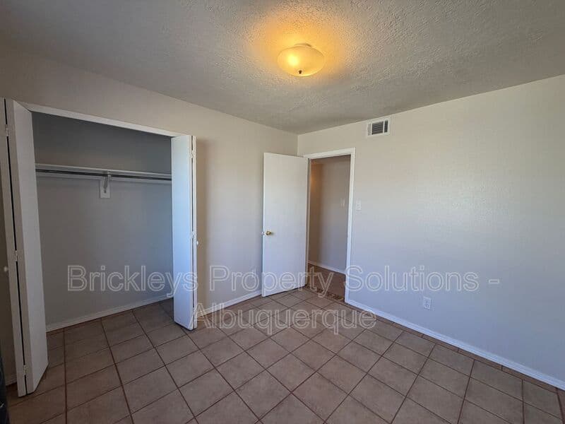 4-bedroom 2-bath home at 5812 Brahma Dr NW for $1,950/mo managed by Brickleys Property Solutions Albuquerque — photo 16 of 35