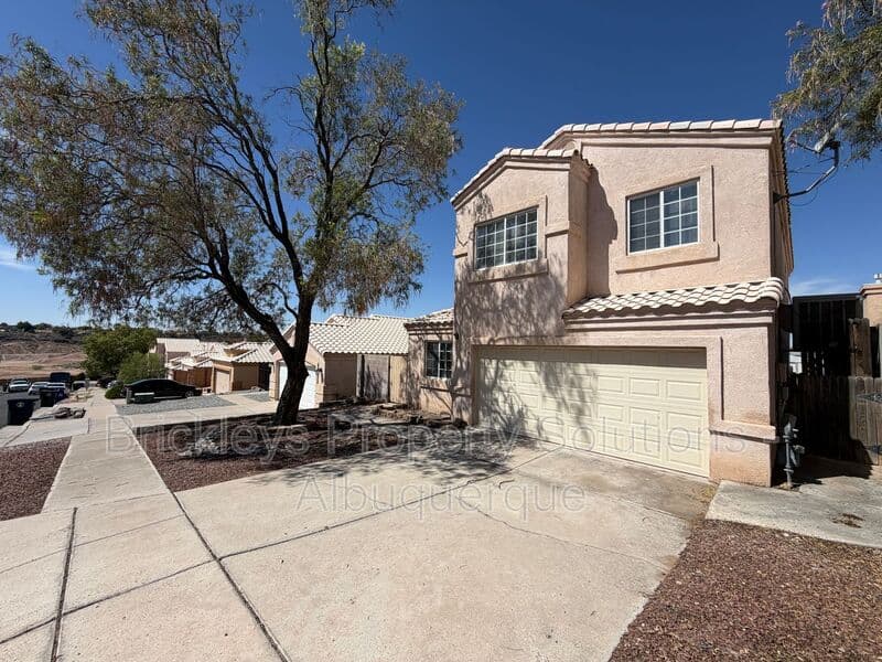 3-bedroom 2.5-bath home at 10527 Brookline Pl NW for $2,300/mo managed by Brickleys Property Solutions Albuquerque — photo 2 of 40