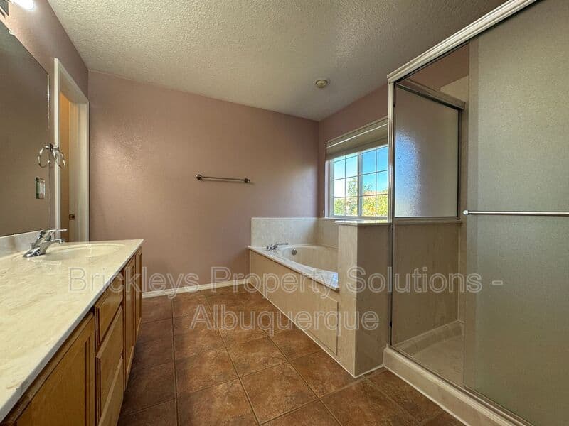 4-bedroom 3-bath home at 7131 Wild Olive Ave NE for $2,900/mo managed by Brickleys Property Solutions Albuquerque — photo 29 of 38