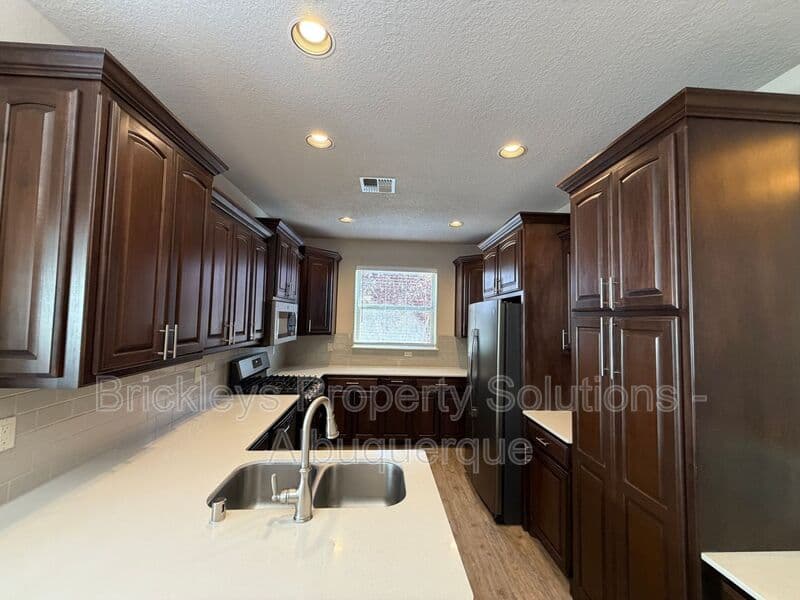 3-bedroom 2-bath home at 5815 Mafraq Ave NW for $2,150/mo managed by Brickleys Property Solutions Albuquerque — photo 6 of 32