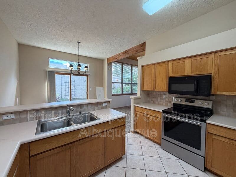 3-bedroom 2-bath home at 12606 Colony Pl NE for $2,250/mo managed by Brickleys Property Solutions Albuquerque — photo 10 of 32