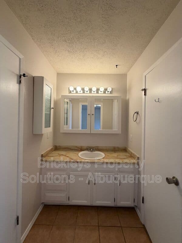 4-bedroom 2-bath home at 5812 Brahma Dr NW for $1,950/mo managed by Brickleys Property Solutions Albuquerque — photo 14 of 35