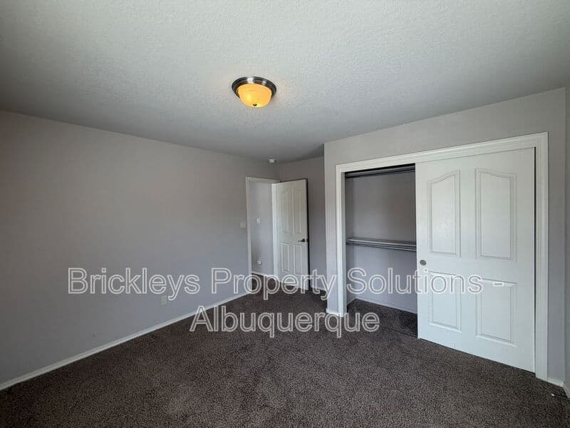 4-bedroom 2.5-bath home at 7420 Tangerine Court NE for $2,450/mo managed by Brickleys Property Solutions Albuquerque — photo 8 of 39