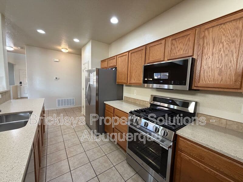 4-bedroom 3.5-bath home at 6228 Nacional Rd NW for $2,700/mo managed by Brickleys Property Solutions Albuquerque — photo 35 of 44