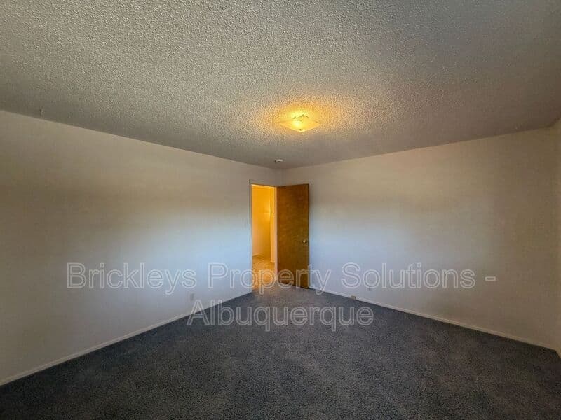 4-bedroom 3-bath home at 7121 Edwina Ave NE for $2,450/mo managed by Brickleys Property Solutions Albuquerque — photo 24 of 47
