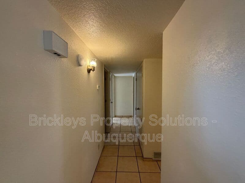 3-bedroom 2-bath home at 9937 Clearwater St. NW for $1,900/mo managed by Brickleys Property Solutions Albuquerque — photo 5 of 27