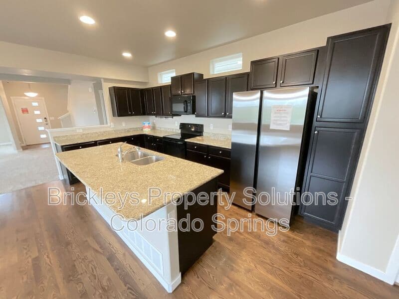 3-bedroom 2.5-bath home at 2401 Ellingwood Dr for $2,233/mo total (includes $2,195 base rent + $38 required Tenant Benefit Package) managed by Brickleys Property Solutions Colorado Springs — photo 15 of 40