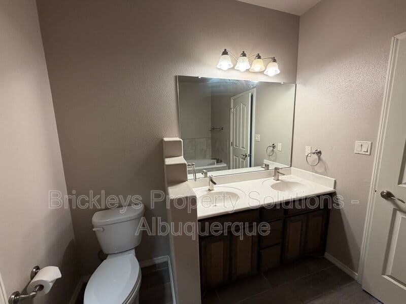 4-bedroom 2.5-bath home at 7420 Tangerine Court NE for $2,450/mo managed by Brickleys Property Solutions Albuquerque — photo 28 of 39