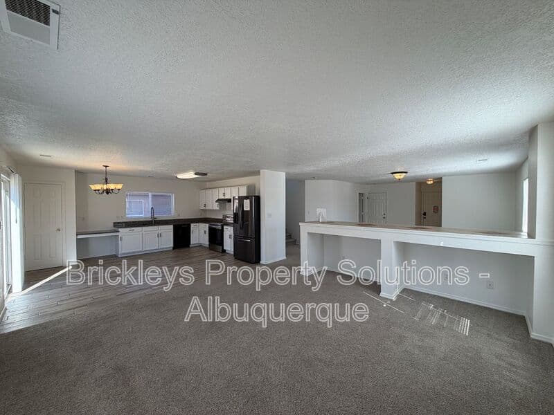 4-bedroom 3-bath home at 6027 Park South Pl NW for $2,400/mo managed by Brickleys Property Solutions Albuquerque — photo 13 of 36