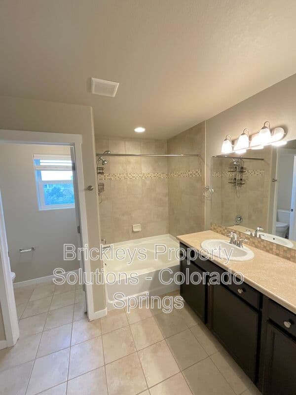 3-bedroom 2.5-bath home at 2401 Ellingwood Dr for $2,233/mo total (includes $2,195 base rent + $38 required Tenant Benefit Package) managed by Brickleys Property Solutions Colorado Springs — photo 30 of 40