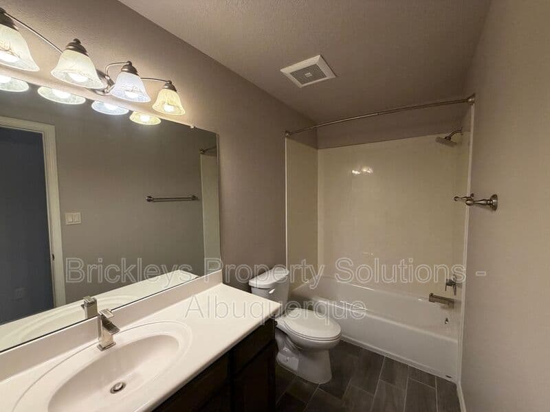 4-bedroom 2.5-bath home at 7420 Tangerine Court NE for $2,450/mo managed by Brickleys Property Solutions Albuquerque — photo 14 of 39