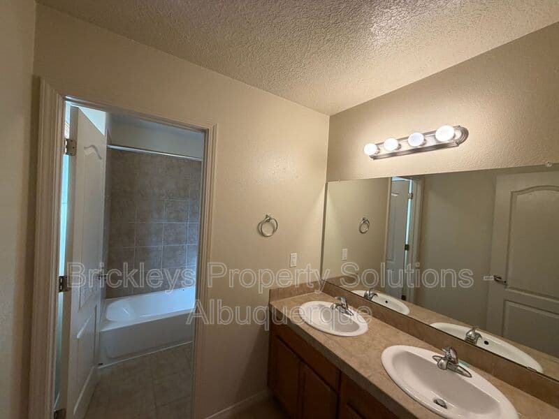 4-bedroom 3.5-bath home at 6228 Nacional Rd NW for $2,700/mo managed by Brickleys Property Solutions Albuquerque — photo 17 of 44