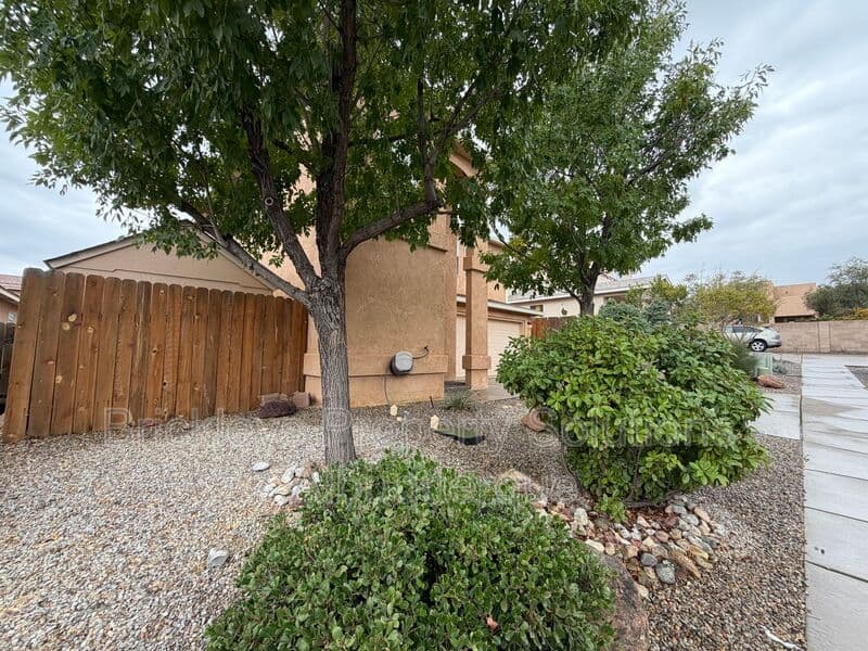 3-bedroom 3-bath home at 5004 Blue Stone Rd NW for $2,250/mo managed by Brickleys Property Solutions Albuquerque — photo 3 of 37