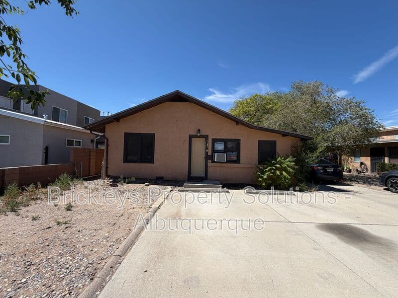4-bedroom 2-bath home at 313 Cornell Drive SE Unit A for $1,600/mo managed by Brickleys Property Solutions Albuquerque — photo 1 of 27