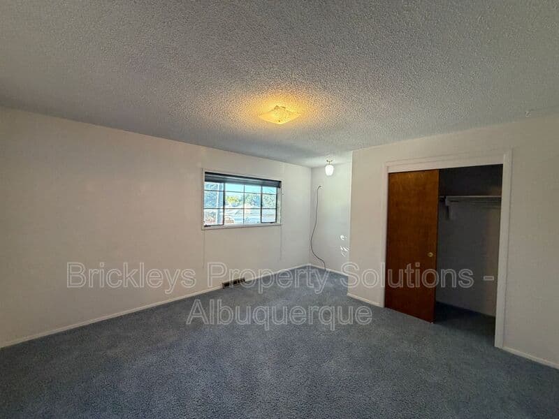 4-bedroom 3-bath home at 7121 Edwina Ave NE for $2,450/mo managed by Brickleys Property Solutions Albuquerque — photo 23 of 47