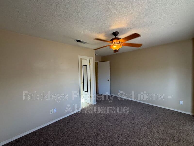 3-bedroom 2-bath home at 7704 Woodstar Ave NW for $1,825/mo managed by Brickleys Property Solutions Albuquerque — photo 14 of 28