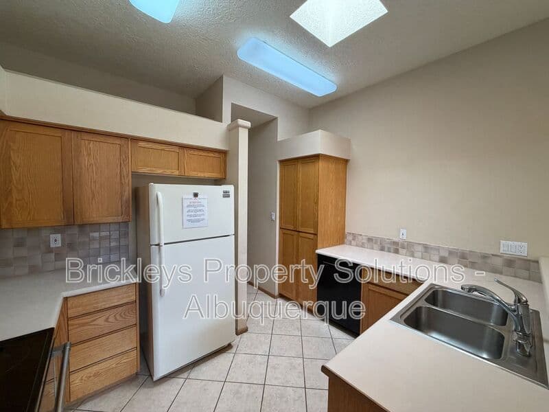 3-bedroom 2-bath home at 12606 Colony Pl NE for $2,250/mo managed by Brickleys Property Solutions Albuquerque — photo 9 of 32