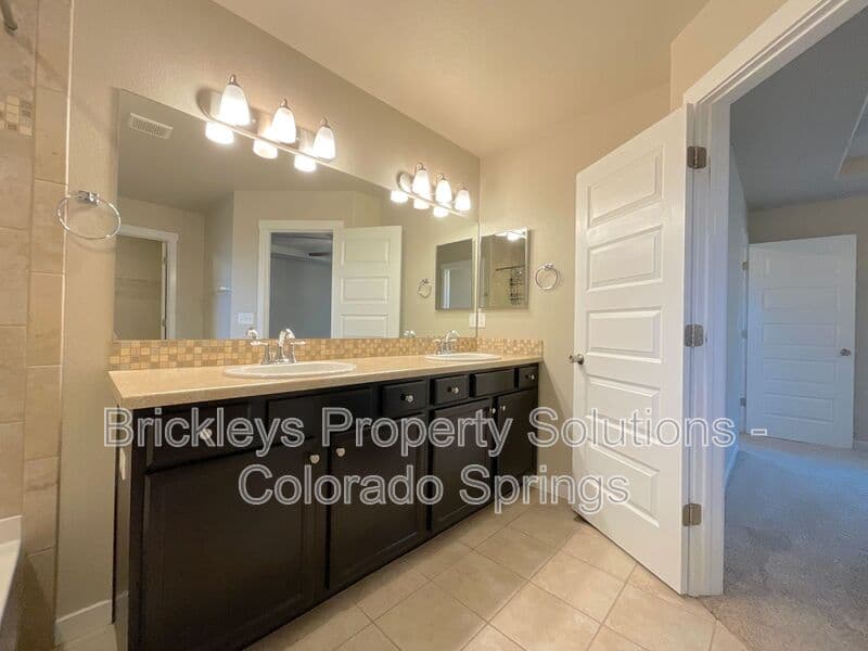 3-bedroom 2.5-bath home at 2401 Ellingwood Dr for $2,233/mo total (includes $2,195 base rent + $38 required Tenant Benefit Package) managed by Brickleys Property Solutions Colorado Springs — photo 29 of 40