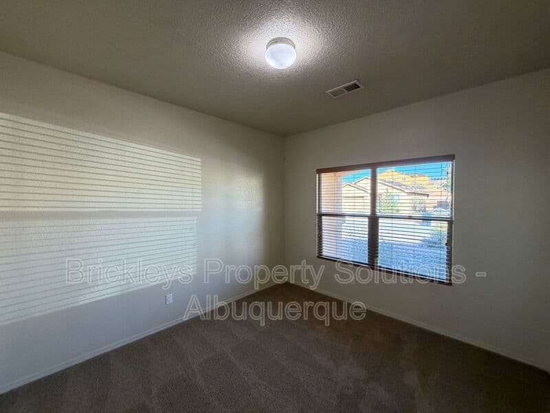 4-bedroom 3.5-bath home at 6228 Nacional Rd NW for $2,700/mo managed by Brickleys Property Solutions Albuquerque — photo 5 of 44