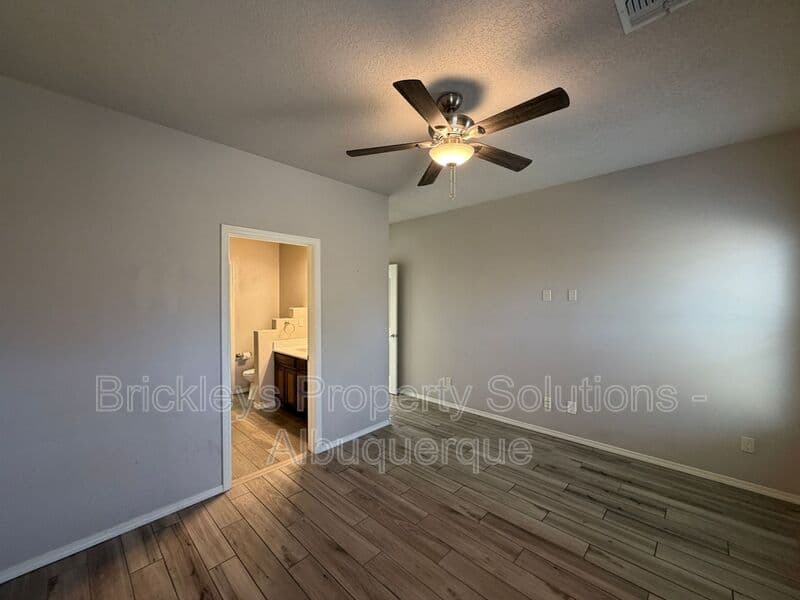 4-bedroom 2.5-bath home at 7420 Tangerine Court NE for $2,450/mo managed by Brickleys Property Solutions Albuquerque — photo 25 of 39