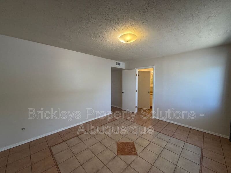 4-bedroom 2-bath home at 5812 Brahma Dr NW for $1,950/mo managed by Brickleys Property Solutions Albuquerque — photo 10 of 35