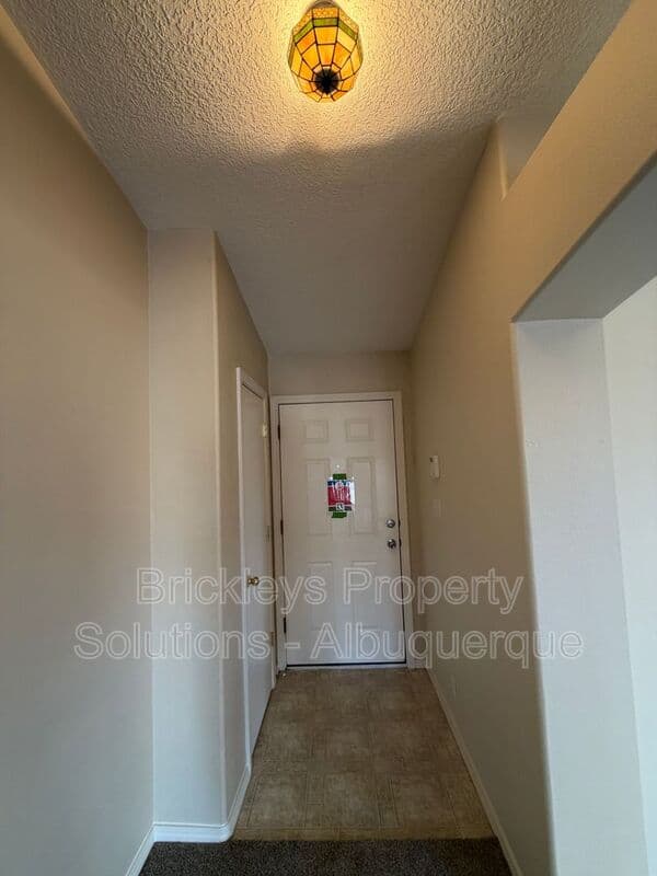 3-bedroom 2-bath home at 7704 Woodstar Ave NW for $1,825/mo managed by Brickleys Property Solutions Albuquerque — photo 4 of 28