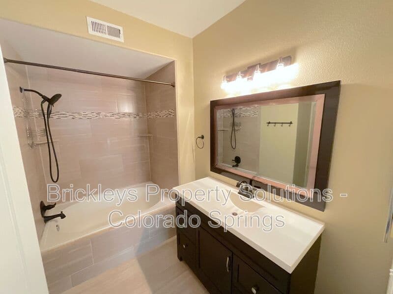 3-bedroom 2-bath home at 3780 Riviera Grove Unit #104 for $1,863/mo total (includes $1,825 base rent + $38 required Tenant Benefit Package) managed by Brickleys Property Solutions Colorado Springs — photo 14 of 24