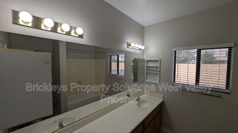 4-bedroom 3-bath home at 13354 W Palm Ln for $2,750/mo managed by Brickleys Property Solutions West Valley Phoenix — photo 17 of 31