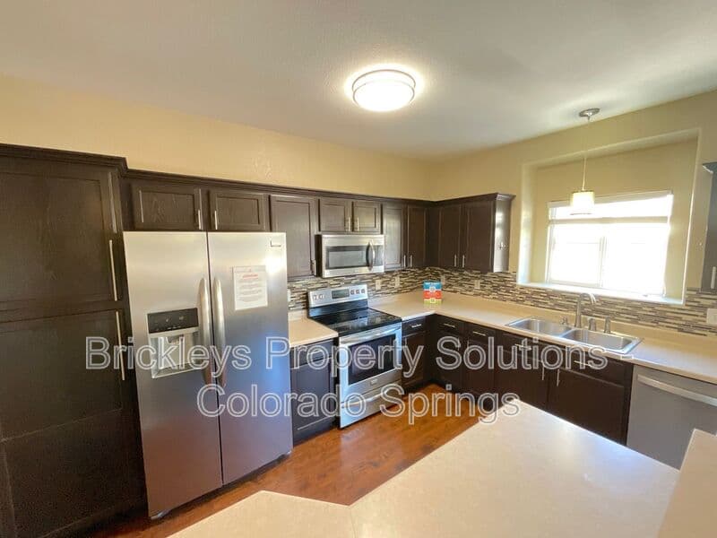 3-bedroom 2-bath home at 3780 Riviera Grove Unit #104 for $1,863/mo total (includes $1,825 base rent + $38 required Tenant Benefit Package) managed by Brickleys Property Solutions Colorado Springs — photo 7 of 24
