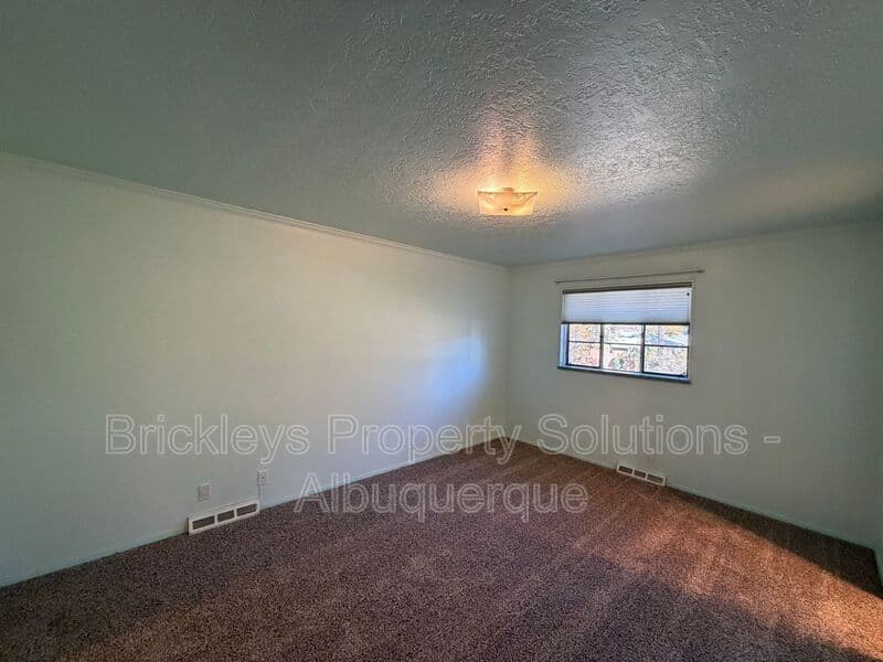 4-bedroom 3-bath home at 7121 Edwina Ave NE for $2,450/mo managed by Brickleys Property Solutions Albuquerque — photo 25 of 47