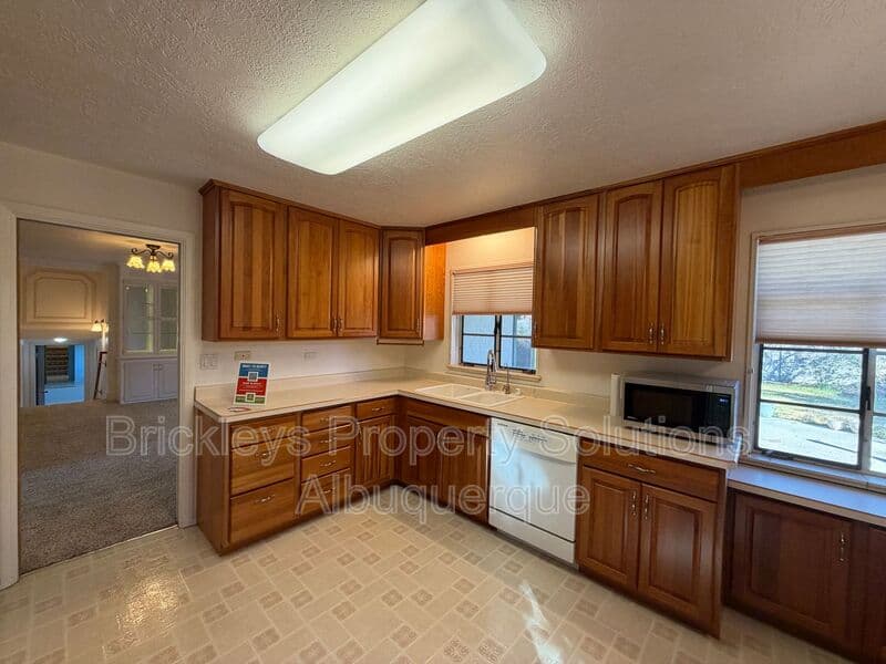 4-bedroom 3-bath home at 7121 Edwina Ave NE for $2,450/mo managed by Brickleys Property Solutions Albuquerque — photo 12 of 47