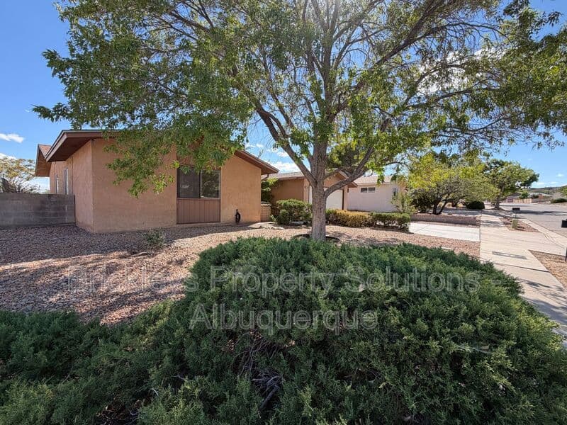 4-bedroom 2-bath home at 5812 Brahma Dr NW for $1,950/mo managed by Brickleys Property Solutions Albuquerque — photo 4 of 35
