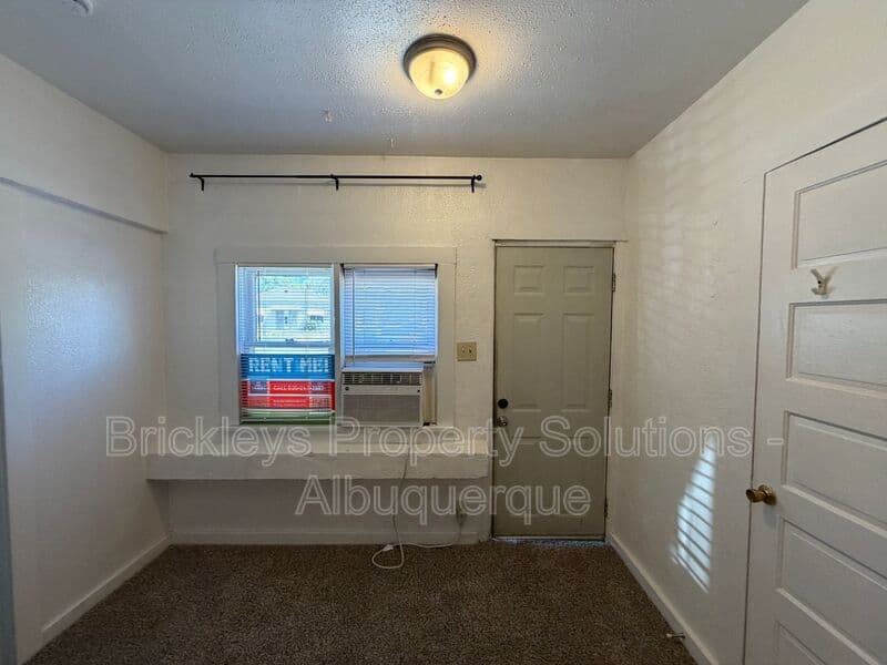 4-bedroom 2-bath home at 313 Cornell Drive SE Unit A for $1,600/mo managed by Brickleys Property Solutions Albuquerque — photo 4 of 27