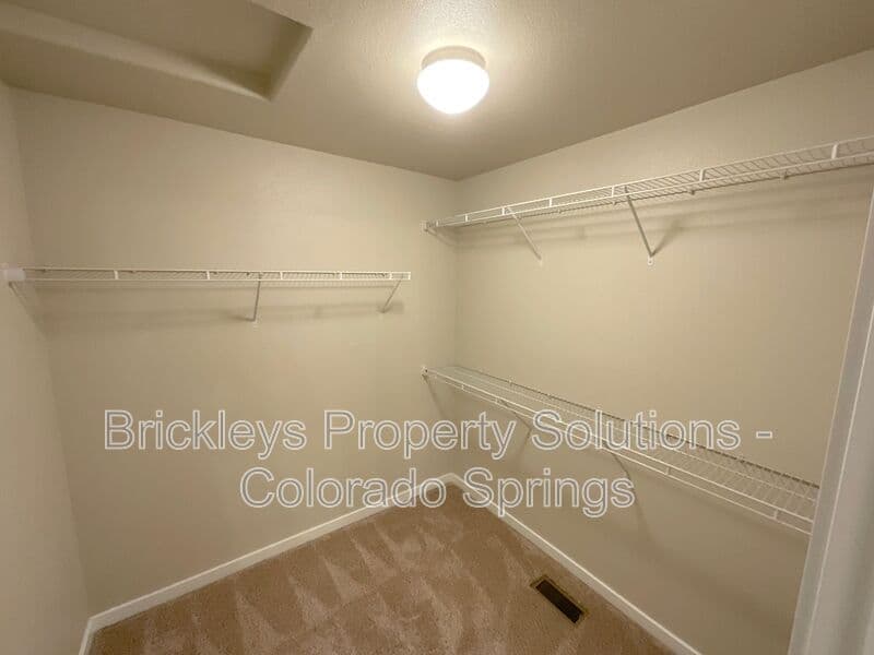 3-bedroom 2.5-bath home at 2401 Ellingwood Dr for $2,233/mo total (includes $2,195 base rent + $38 required Tenant Benefit Package) managed by Brickleys Property Solutions Colorado Springs — photo 31 of 40