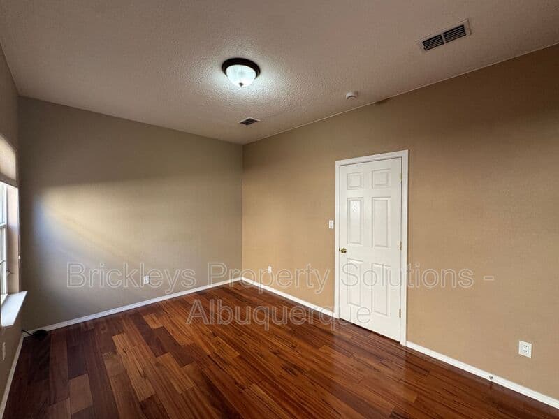 4-bedroom 3-bath home at 7131 Wild Olive Ave NE for $2,900/mo managed by Brickleys Property Solutions Albuquerque — photo 18 of 38