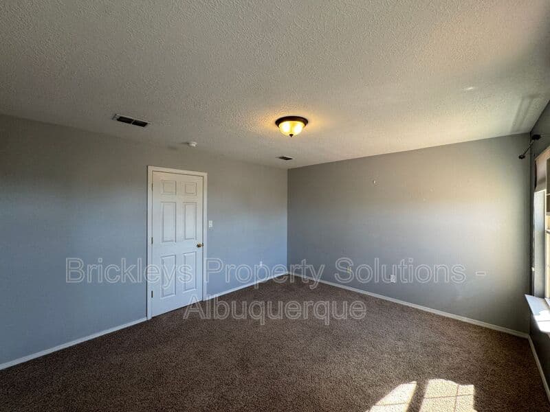 4-bedroom 3-bath home at 7131 Wild Olive Ave NE for $2,900/mo managed by Brickleys Property Solutions Albuquerque — photo 22 of 38