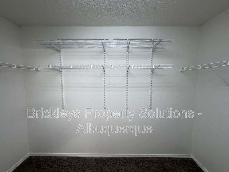 4-bedroom 3-bath home at 6027 Park South Pl NW for $2,400/mo managed by Brickleys Property Solutions Albuquerque — photo 23 of 36