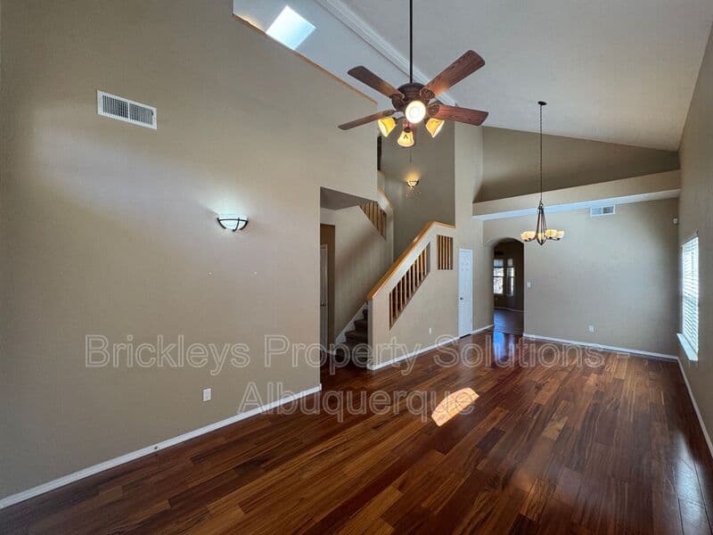 4-bedroom 3-bath home at 7131 Wild Olive Ave NE for $2,900/mo managed by Brickleys Property Solutions Albuquerque — photo 6 of 38